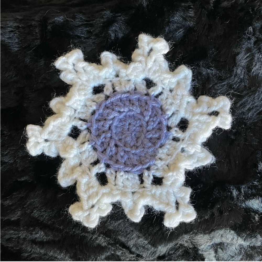 NWT crocheted periwinkle, purple center, snowflake coasters set of four